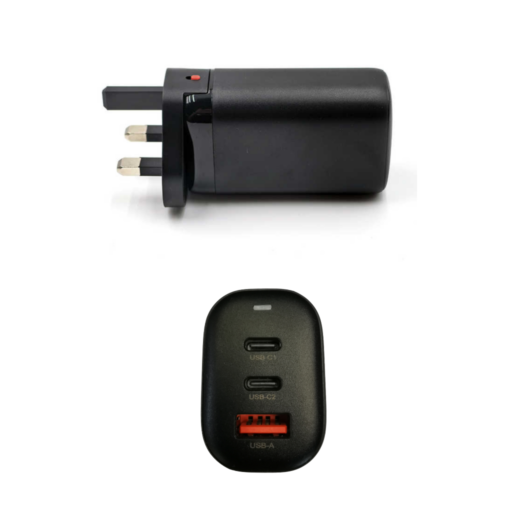 Black travel adapter with multiple plug sockets and USB ports on a white background