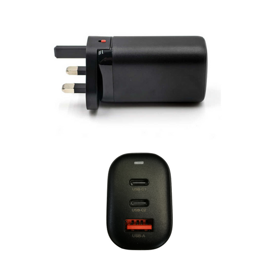 Black travel adapter with multiple plug sockets and USB ports on a white background